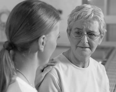 Nurse comforts woman emotionally